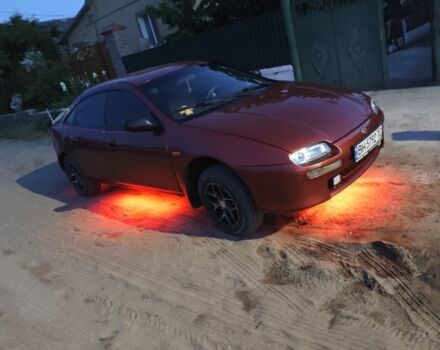 Червоний Мазда 323, об'ємом двигуна 1.5 л та пробігом 316 тис. км за 1615 $, фото 1 на Automoto.ua