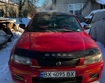 Красный Мазда 323, объемом двигателя 1.49 л и пробегом 308 тыс. км за 2700 $, фото 1 на Automoto.ua