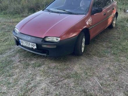 Красный Мазда 323, объемом двигателя 1.5 л и пробегом 237 тыс. км за 850 $, фото 1 на Automoto.ua