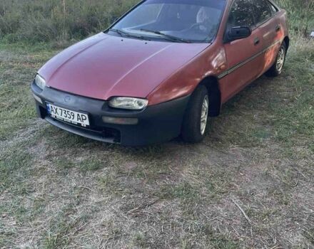 Красный Мазда 323, объемом двигателя 1.5 л и пробегом 237 тыс. км за 950 $, фото 1 на Automoto.ua