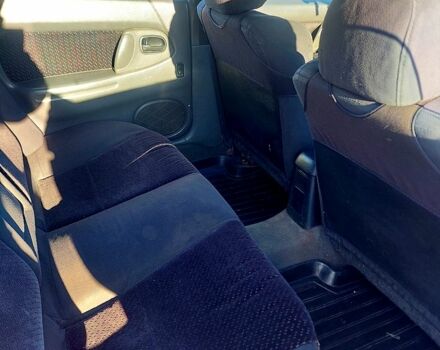 Красный Мазда 323, объемом двигателя 1.5 л и пробегом 396 тыс. км за 2000 $, фото 1 на Automoto.ua