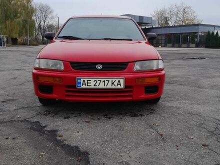 Червоний Мазда 323, об'ємом двигуна 1.49 л та пробігом 290 тис. км за 2800 $, фото 1 на Automoto.ua