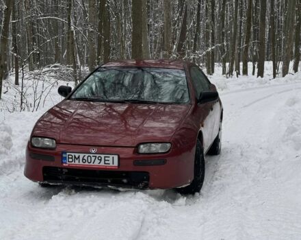 Красный Мазда 323, объемом двигателя 1.5 л и пробегом 390 тыс. км за 2450 $, фото 1 на Automoto.ua