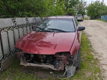 Красный Мазда 323, объемом двигателя 1.5 л и пробегом 500 тыс. км за 1000 $, фото 1 на Automoto.ua