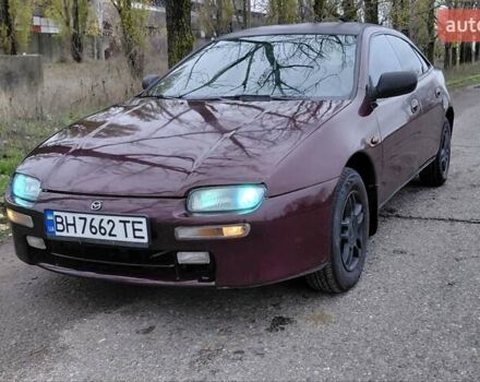 Красный Мазда 323, объемом двигателя 1.49 л и пробегом 153 тыс. км за 1700 $, фото 1 на Automoto.ua