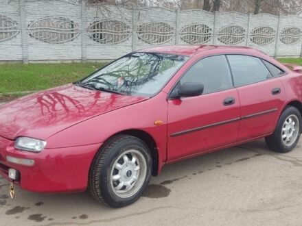 Красный Мазда 323, объемом двигателя 1.5 л и пробегом 367 тыс. км за 2400 $, фото 1 на Automoto.ua