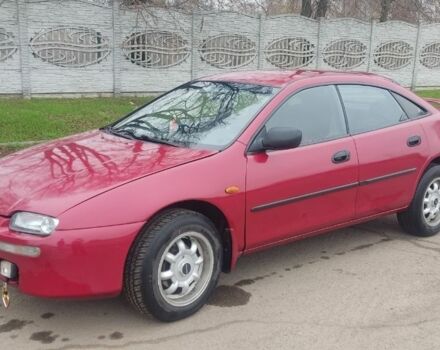 Красный Мазда 323, объемом двигателя 1.5 л и пробегом 367 тыс. км за 2400 $, фото 1 на Automoto.ua