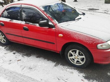 Красный Мазда 323, объемом двигателя 1.5 л и пробегом 381 тыс. км за 1450 $, фото 1 на Automoto.ua