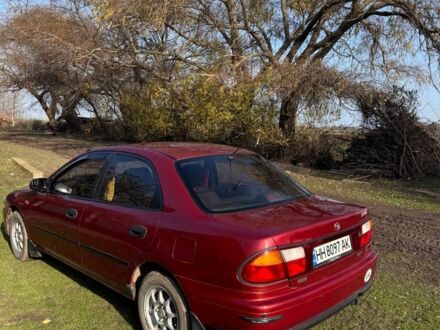 Червоний Мазда 323, об'ємом двигуна 1.8 л та пробігом 1 тис. км за 2450 $, фото 1 на Automoto.ua