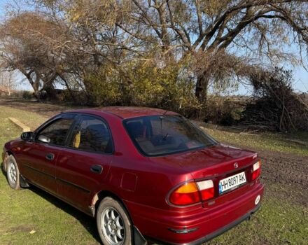 Красный Мазда 323, объемом двигателя 1.8 л и пробегом 1 тыс. км за 2450 $, фото 1 на Automoto.ua