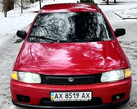 Красный Мазда 323, объемом двигателя 1.5 л и пробегом 300 тыс. км за 1500 $, фото 1 на Automoto.ua