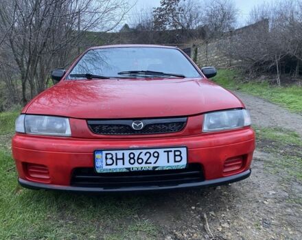 Красный Мазда 323, объемом двигателя 1.5 л и пробегом 2 тыс. км за 2000 $, фото 1 на Automoto.ua