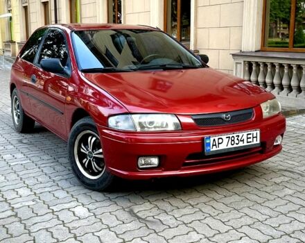 Красный Мазда 323, объемом двигателя 1.3 л и пробегом 340 тыс. км за 1850 $, фото 1 на Automoto.ua