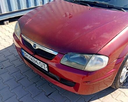 Червоний Мазда 323, об'ємом двигуна 1.5 л та пробігом 260 тис. км за 1500 $, фото 1 на Automoto.ua