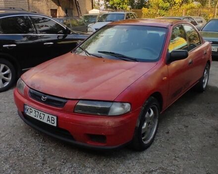 Красный Мазда 323, объемом двигателя 1.5 л и пробегом 250 тыс. км за 1500 $, фото 1 на Automoto.ua