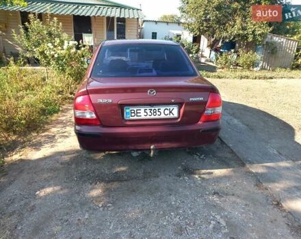 Красный Мазда 323, объемом двигателя 2 л и пробегом 325 тыс. км за 3600 $, фото 1 на Automoto.ua