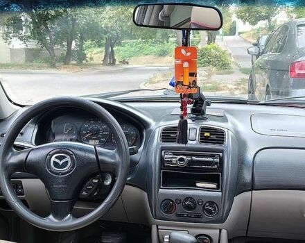 Червоний Мазда 323, об'ємом двигуна 2 л та пробігом 188 тис. км за 2500 $, фото 1 на Automoto.ua