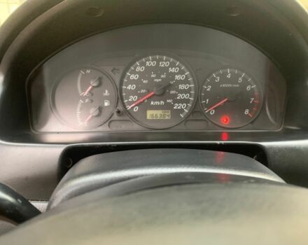 Красный Мазда 323, объемом двигателя 2 л и пробегом 167 тыс. км за 2400 $, фото 1 на Automoto.ua