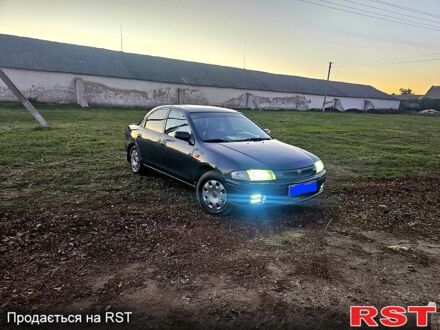 Мазда 323 1996 в Покровском на Automoto.ua Мазда 323, объемом двигателя 1.5 л и пробегом 400 тыс. км за 1560 $, фото 1 на Automoto.ua