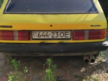 Жовтий Мазда 323, об'ємом двигуна 1.3 л та пробігом 300 тис. км за 190 $, фото 1 на Automoto.ua