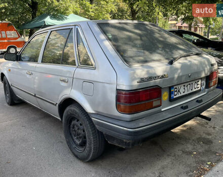 Серый Мазда 323, объемом двигателя 1.32 л и пробегом 255 тыс. км за 900 $, фото 5 на Automoto.ua