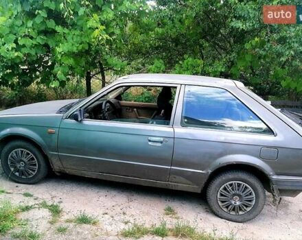 Серый Мазда 323, объемом двигателя 1.5 л и пробегом 500 тыс. км за 380 $, фото 3 на Automoto.ua
