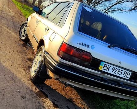 Серый Мазда 323, объемом двигателя 1.3 л и пробегом 454 тыс. км за 850 $, фото 1 на Automoto.ua