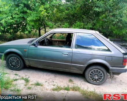 Серый Мазда 323, объемом двигателя 1.5 л и пробегом 500 тыс. км за 380 $, фото 4 на Automoto.ua