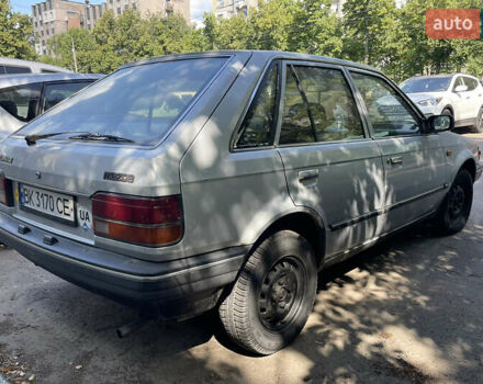 Серый Мазда 323, объемом двигателя 1.32 л и пробегом 255 тыс. км за 900 $, фото 6 на Automoto.ua