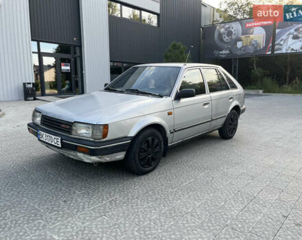Сірий Мазда 323, об'ємом двигуна 1.32 л та пробігом 260 тис. км за 890 $, фото 4 на Automoto.ua