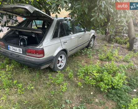 Серый Мазда 323, объемом двигателя 1.32 л и пробегом 153 тыс. км за 1075 $, фото 4 на Automoto.ua