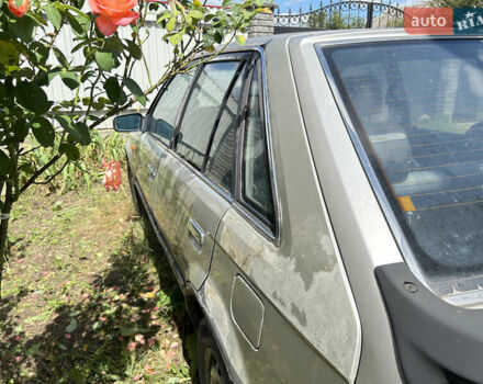 Серый Мазда 323, объемом двигателя 1.3 л и пробегом 200 тыс. км за 1001 $, фото 3 на Automoto.ua