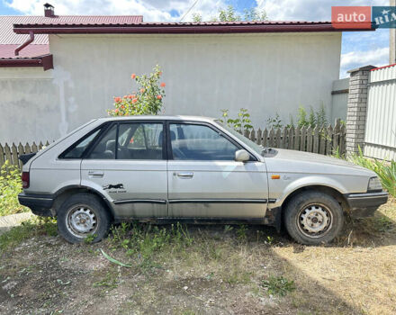 Серый Мазда 323, объемом двигателя 1.3 л и пробегом 200 тыс. км за 1001 $, фото 2 на Automoto.ua
