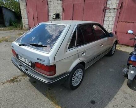 Серый Мазда 323, объемом двигателя 1.3 л и пробегом 210 тыс. км за 1700 $, фото 1 на Automoto.ua