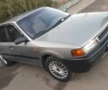 Сірий Мазда 323, об'ємом двигуна 1.5 л та пробігом 219 тис. км за 2000 $, фото 1 на Automoto.ua
