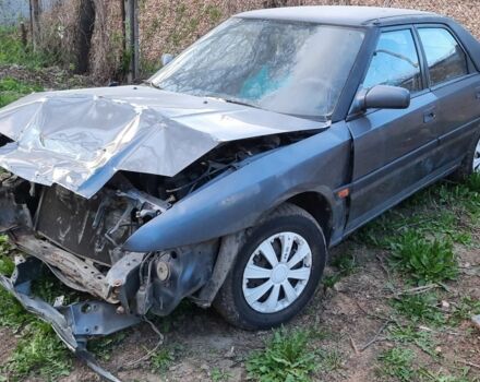 Сірий Мазда 323, об'ємом двигуна 1.8 л та пробігом 380 тис. км за 696 $, фото 1 на Automoto.ua