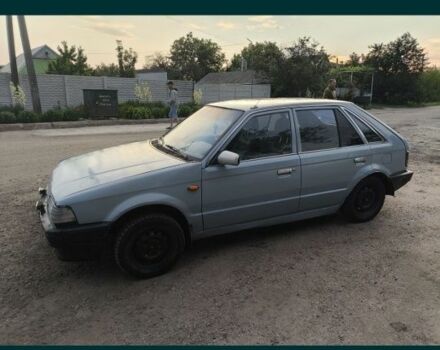 Серый Мазда 323, объемом двигателя 0 л и пробегом 222 тыс. км за 25000 $, фото 1 на Automoto.ua