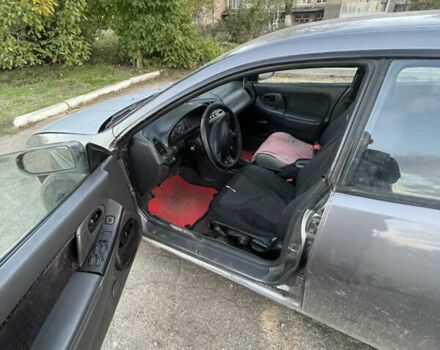 Серый Мазда 323, объемом двигателя 2 л и пробегом 280 тыс. км за 2500 $, фото 1 на Automoto.ua