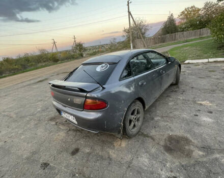 Серый Мазда 323, объемом двигателя 2 л и пробегом 280 тыс. км за 2500 $, фото 3 на Automoto.ua