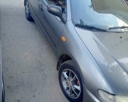 Серый Мазда 323, объемом двигателя 1.49 л и пробегом 300 тыс. км за 2600 $, фото 1 на Automoto.ua