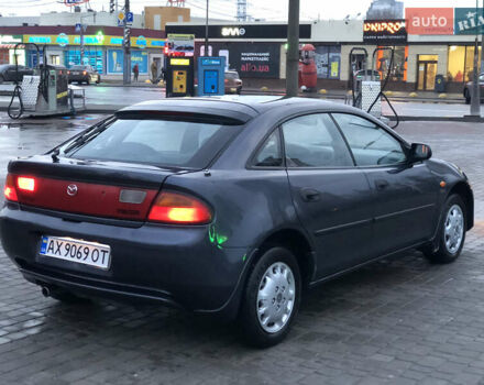 Серый Мазда 323, объемом двигателя 1.5 л и пробегом 199 тыс. км за 2000 $, фото 5 на Automoto.ua