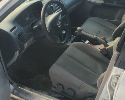 Серый Мазда 323, объемом двигателя 2 л и пробегом 300 тыс. км за 950 $, фото 4 на Automoto.ua