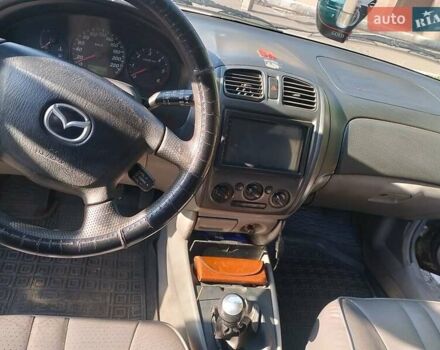 Сірий Мазда 323, об'ємом двигуна 2 л та пробігом 300 тис. км за 2906 $, фото 6 на Automoto.ua