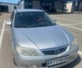 Серый Мазда 323, объемом двигателя 2 л и пробегом 284 тыс. км за 2300 $, фото 1 на Automoto.ua