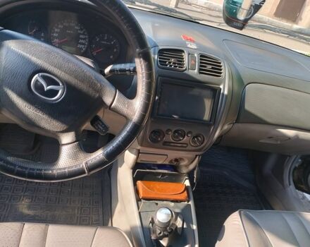 Сірий Мазда 323, об'ємом двигуна 2 л та пробігом 300 тис. км за 2906 $, фото 7 на Automoto.ua