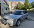 Серый Мазда 323, объемом двигателя 2 л и пробегом 400 тыс. км за 1350 $, фото 1 на Automoto.ua