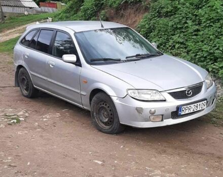 Серый Мазда 323, объемом двигателя 2 л и пробегом 230 тыс. км за 700 $, фото 1 на Automoto.ua