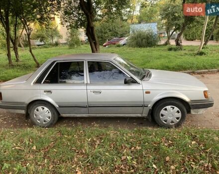 Серый Мазда 323, объемом двигателя 1.3 л и пробегом 300 тыс. км за 1000 $, фото 1 на Automoto.ua
