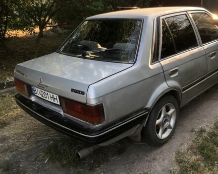 Серый Мазда 323, объемом двигателя 1.3 л и пробегом 290 тыс. км за 1150 $, фото 1 на Automoto.ua