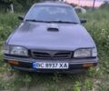 Серый Мазда 323, объемом двигателя 1.5 л и пробегом 300 тыс. км за 269 $, фото 1 на Automoto.ua